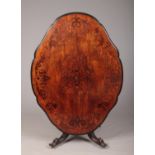 A Victorian figured mahogany snap top centre table of scalloped lozenge form. With marquetry