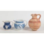 Two 19th century blue ground pearlware jugs decorated with sprigged mouldings and a Cypriot