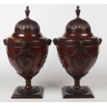 A pair of Neo-Classical style mahogany fitted knife boxes of urn form. With carved ram masks and