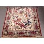 Red ground Kashmir rug with a traditional hunting scene, 240 x 160cm.