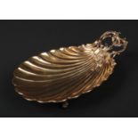 A 19th century French silver gilt shell formed bon bon dish of heavy gauge. With rococo foliate
