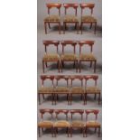 A set of fourteen William IV mahogany dining chairs. With curved bar shaped cresting rails and