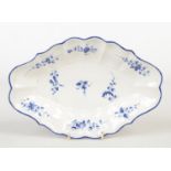 A Caughley scalloped dessert dish. Painted in underglaze blue with scattered sprigs under a blue