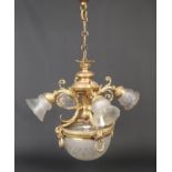 A gilt metal five branch hanging light in Neo-Classical style. Ornamented with ram masks and husk