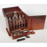 An early 19th century mahogany travelling medicine chest or apothecary cabinet. Opening to reveal