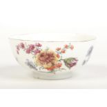 A Chelsea bowl of plain thrown form. Painted in coloured enamels in the Meissen style with flowers
