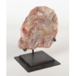 A sliced geological agate specimen on metal stand, specimen 15cm.