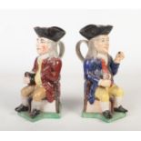 Two 19th century Staffordshire thin man Toby jugs. Each modelled wearing a tricorn hat, holding a