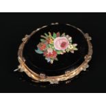 A 19th century Italian micro mosaic brooch. Mounted in yellow metal and depicting a bouquet of