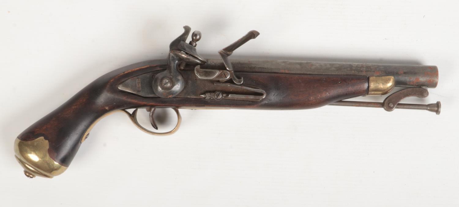 A Tower pattern flintlock pistol with walnut fullstock, brass mounts and swivel ramrod. Lockplate