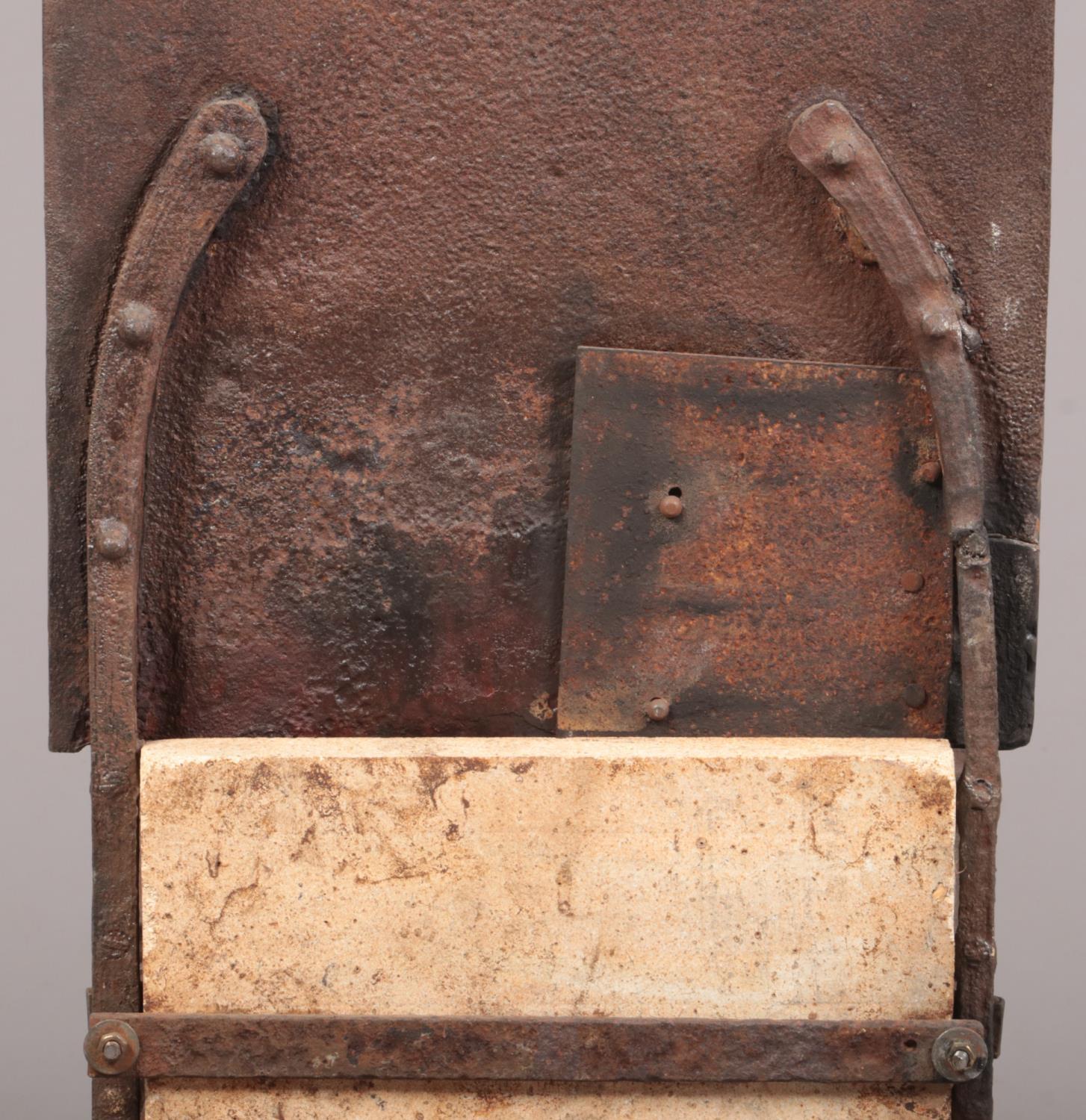 An 18th century wrought iron fire grate. The arch top back decorated in relief with a figure and - Image 4 of 8