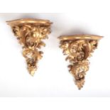 A pair of 19th century Florentine giltwood wall brackets. With shell formed serpentine platforms