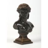 A 19th century French bronze and spelter bust on stepped square socle plinth. Formed as a Grecian