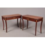 A pair of mahogany fold over tea tables with double gate supports. Having reeded mouldings,