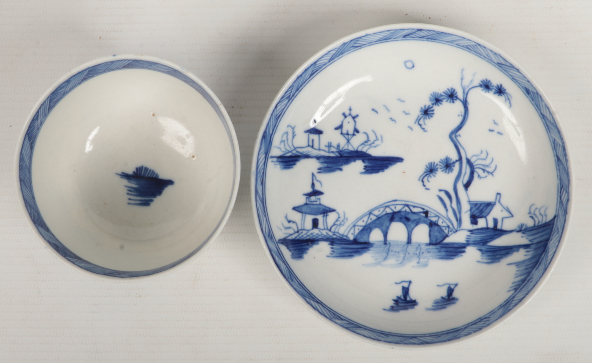 a Caughley teabowl and saucer. Painted in underglaze blue with the Bridge and Windmill pattern c. - Image 4 of 6