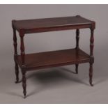 A Regency mahogany two-tier buffet side table raised on turned supports.