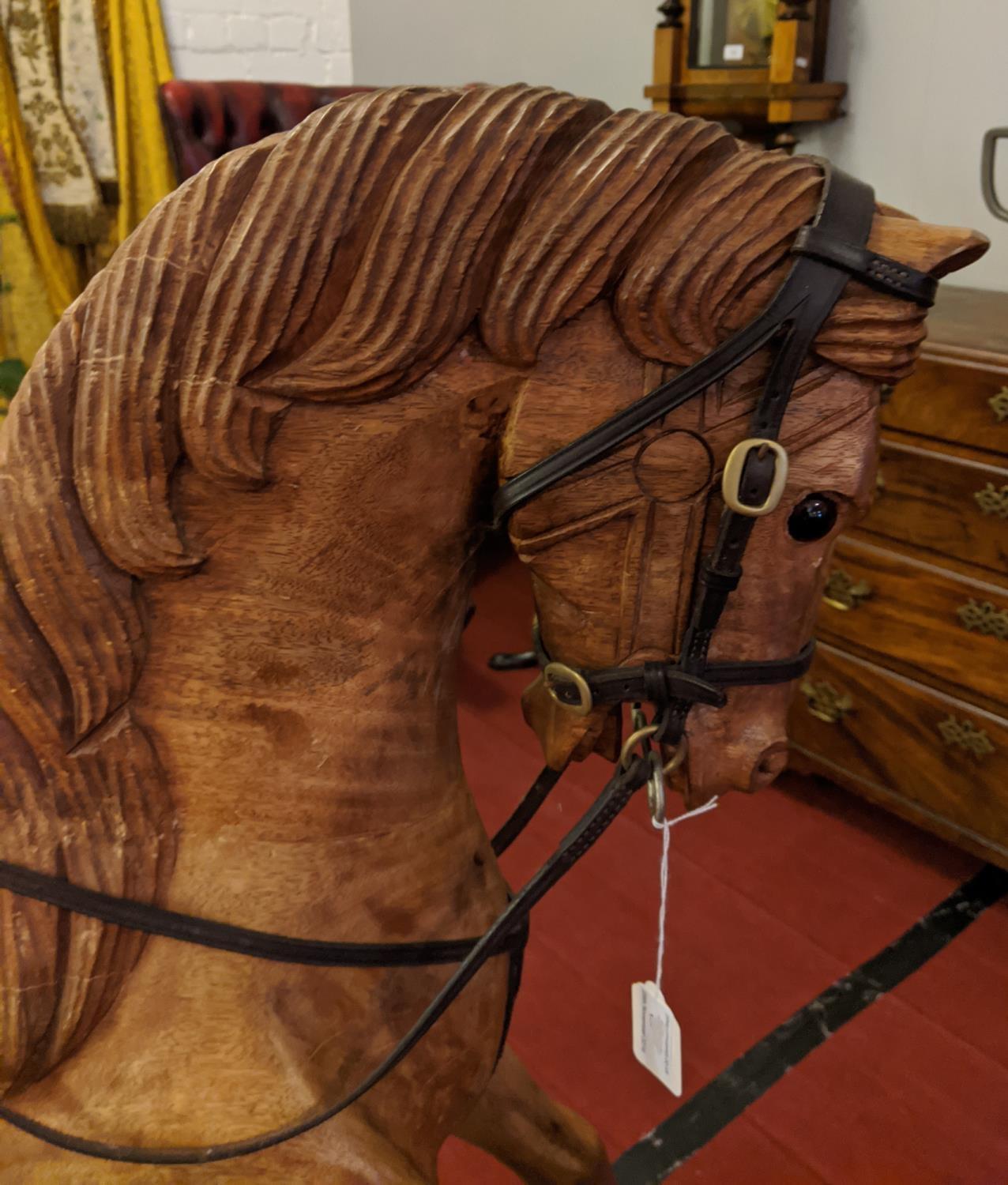 A large carved hardwood child's rocking horse with leather saddle and bridle, 105cm high. Stripped - Image 3 of 8