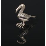A silver and marble model of a bird with coloured glass set eyes, 7cm high.