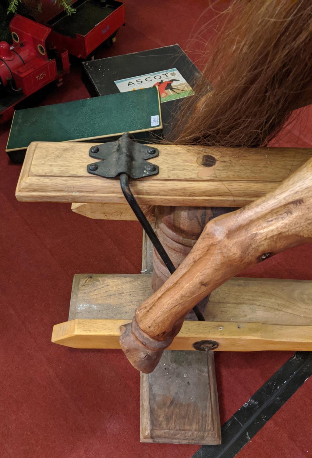 A large carved hardwood child's rocking horse with leather saddle and bridle, 105cm high. Stripped - Image 5 of 8