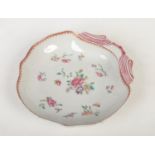 An 18th century Chinese export shell formed dessert dish. Painted in the famille style with