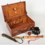 A vintage tan leather fitted vanity case monogramed M. F. along with a quantity of sport / hunting