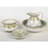 A Doulton Burslem Art Nouveau Kelmscot pattern toilet set comprising jug and bowl, chamber pot and a