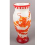A large overlaid glass vase, decorated with dragons. (39cm tall)