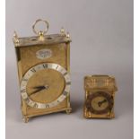 Two brass carriage clocks to include, a "Tempus Fugit" carriage clock and a "Smiths" brass