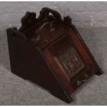 A Victorian carved mahogany coal scuttle.