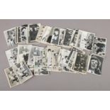 A collection of approximately 62 1960s black and white The Beatles Topps Chewing Gum cards, second