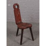 A Three legged carved pine spinning chair