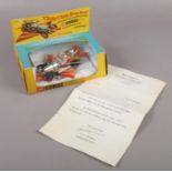 A boxed Corgi Toys Chitty Chitty Bang Bang diecast model vehicle, with associated Daily Express