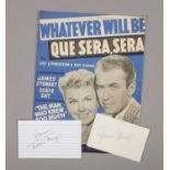 Doris Day and James Stewart autographed pages, along with a Whatever Will Be Que Sera, Sera music