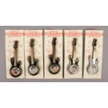 A set of five Invicta Plastics The Fabulous Beatles guitar shaped jewellery brooches, with inset