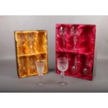 Two boxed set of 6 Bohemia Crystal wine glasses. Two glasses with rim chips.
