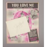 A James Cagney autographed page, along with a Fine and Dandy, You Love Me sheet music booklet.
