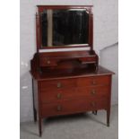 An inlaid mahogany dressing table. (115cm x 178cm)