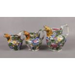A set of three graduated Yorkshire pottery jugs, possibly Twigg of Kilnhurst. Each with a moulded