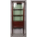 A Victorian mahogany display cabinet raised on slender tapering legs. (185cm x 73cm)