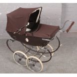 A late 1980s/90s silver cross children's pram.