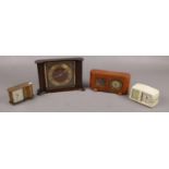 Three small alarm clocks to include Kasier, Peter, etc along with a Smith's mantel clock.