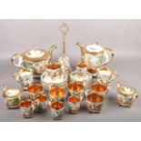 A collection of capodimonte teawares with gilt and cherubs decoration to include teapot, cup &
