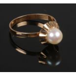A 18ct gold pearl ring (tests as gold) continental marks to outside of the shank. Size N. 1.69g