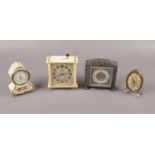 Four plastic and metal alarm clocks to include, "Estyma" cream clock decorated with multi coloured