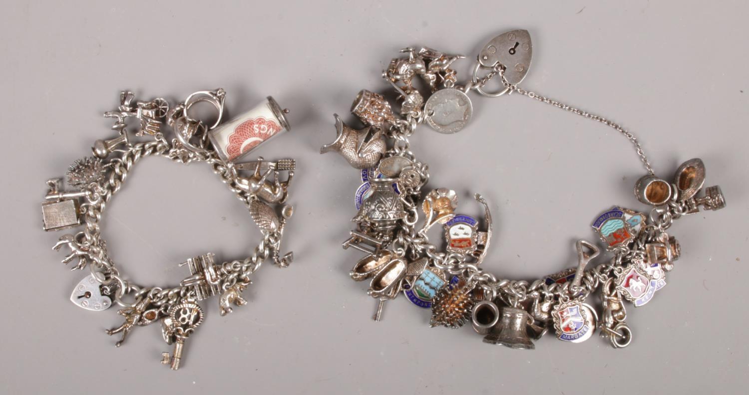 Two silver charm bracelets, with silver and white metal charms.