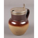 A Victorian stoneware mustard pot, with silver top assayed London 1876. (Height 8.5cm).