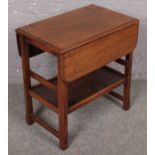 A small oak drop leaf table, when assembled (79cm x 65cm)