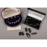 A Bond Boyd sterling silver paste set jewellery suite, along with a silver necklace and collection