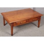 A hardwood metamorphic coffee table/storage unit. (50cm x 121cm)