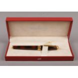 A boxed S. T. Dupont of Paris fountain pen with 18ct gold nib. Having tortoiseshell effect laque